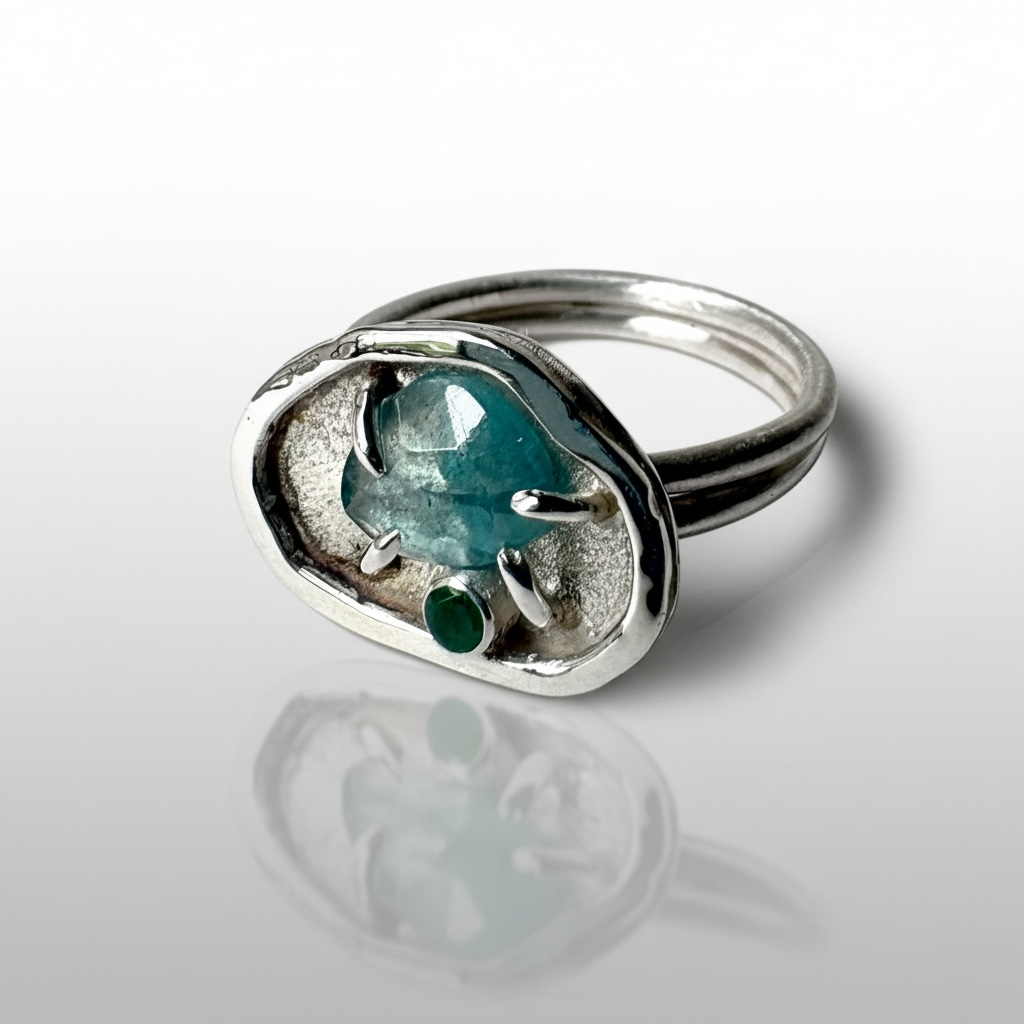Blue Topaz Emerald Nurture Ring feature
